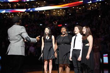 Left to right: Robert Gould, Adeline Um, Lea Grace  Hicks-Swinson, Calvin Falcon, and Grace Mann perform the national anthem at TD  Bank Garden. Photo by Kelly Davidson